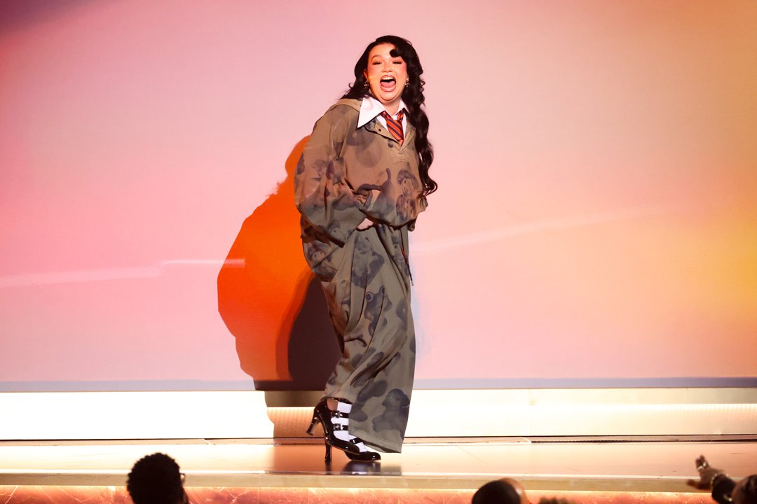 Lola Young is called on stage to accept the award for Best Pop Solo Performance for