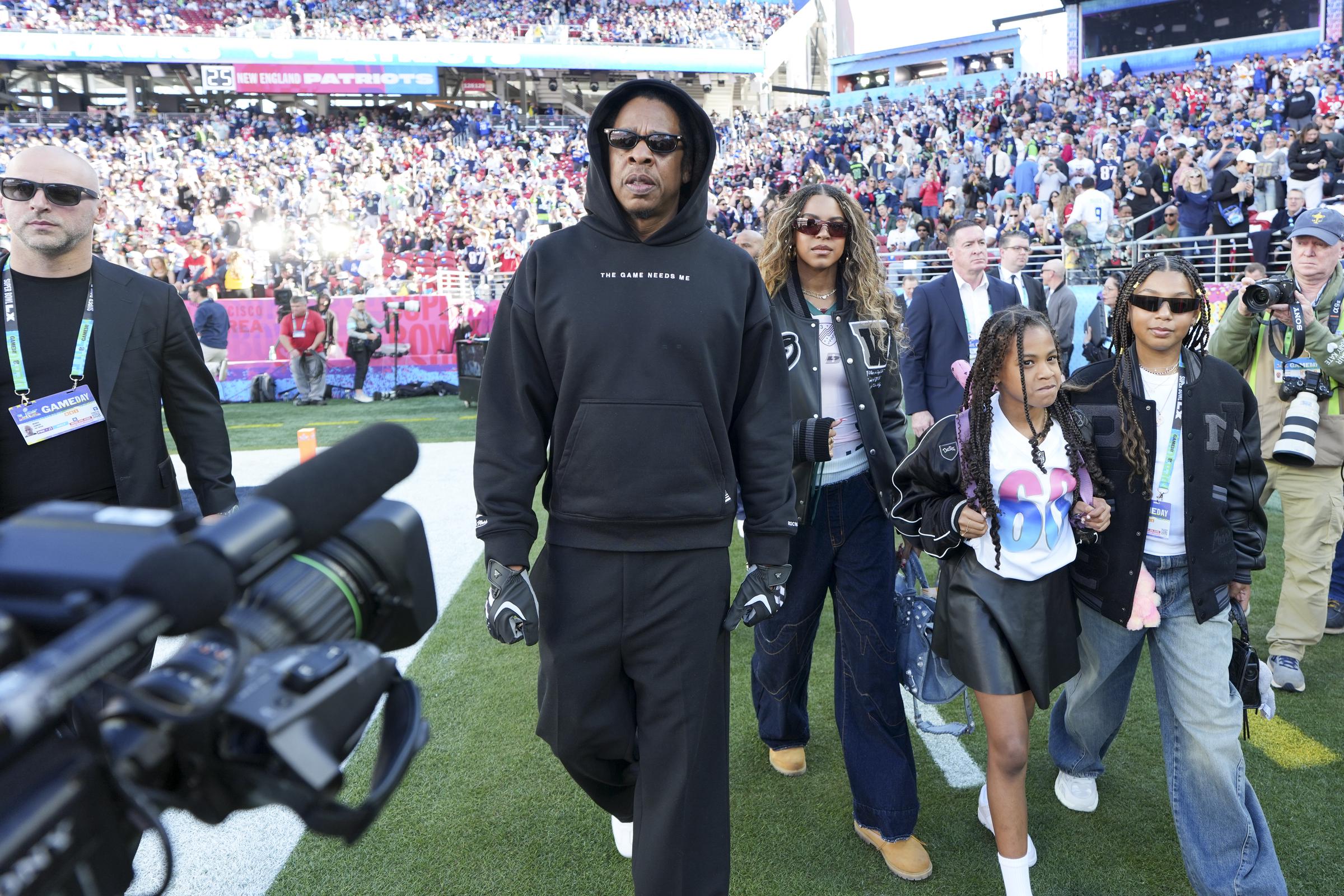 Jay-Z, Blue Ivy Carter and Rumi Carter prior to Super Bowl LX at Levi's Stadium on February 8, 2026, in Santa Clara, California | Source: Getty Images