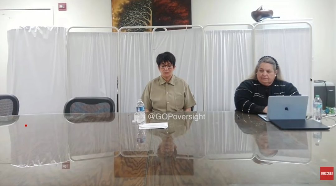 Streaming From Behind Bars: Maxwell appears virtually from prison during a closed-door Capitol Hill hearing on 9 February 2026. Wearing beige prison garb and round glasses, she sits stiffly at a table with water and papers placed precisely in front of her. Her face is blank, her voice steady, as she chillingly invokes her Fifth Amendment right again and again &mdash; refusing to answer questions about her role in Epstein's abuse network. | Source: YouTube/New York Post
