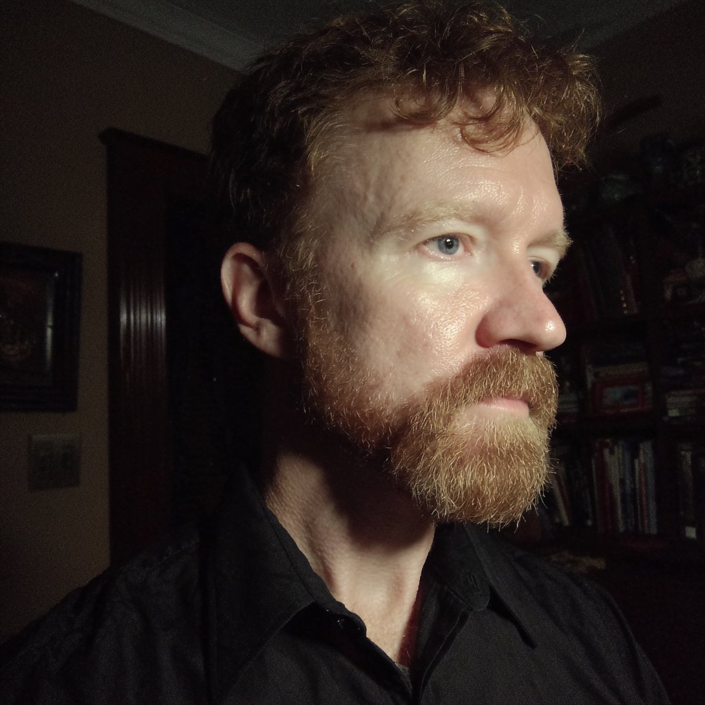 A man wearing a black formal shirt | Source: Midjourney