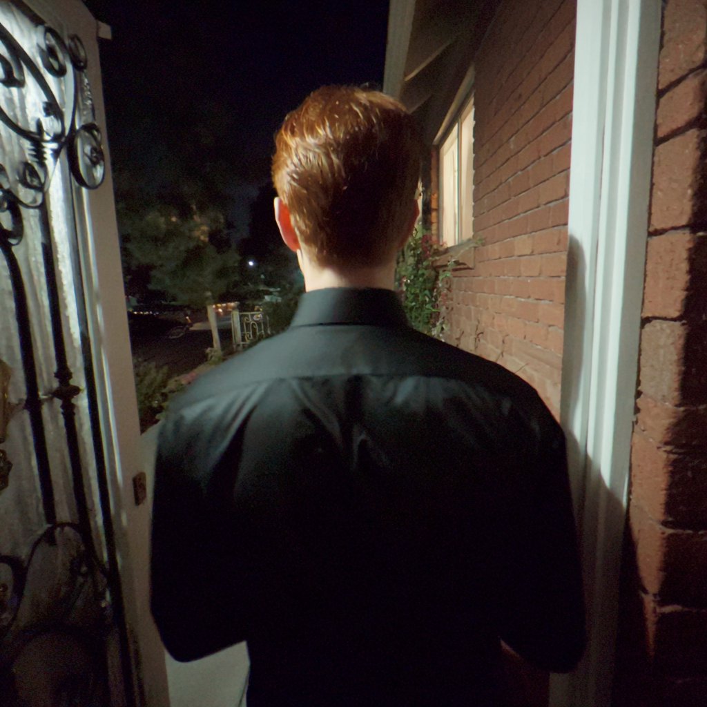 A man walking out a front door | Source: Midjourney