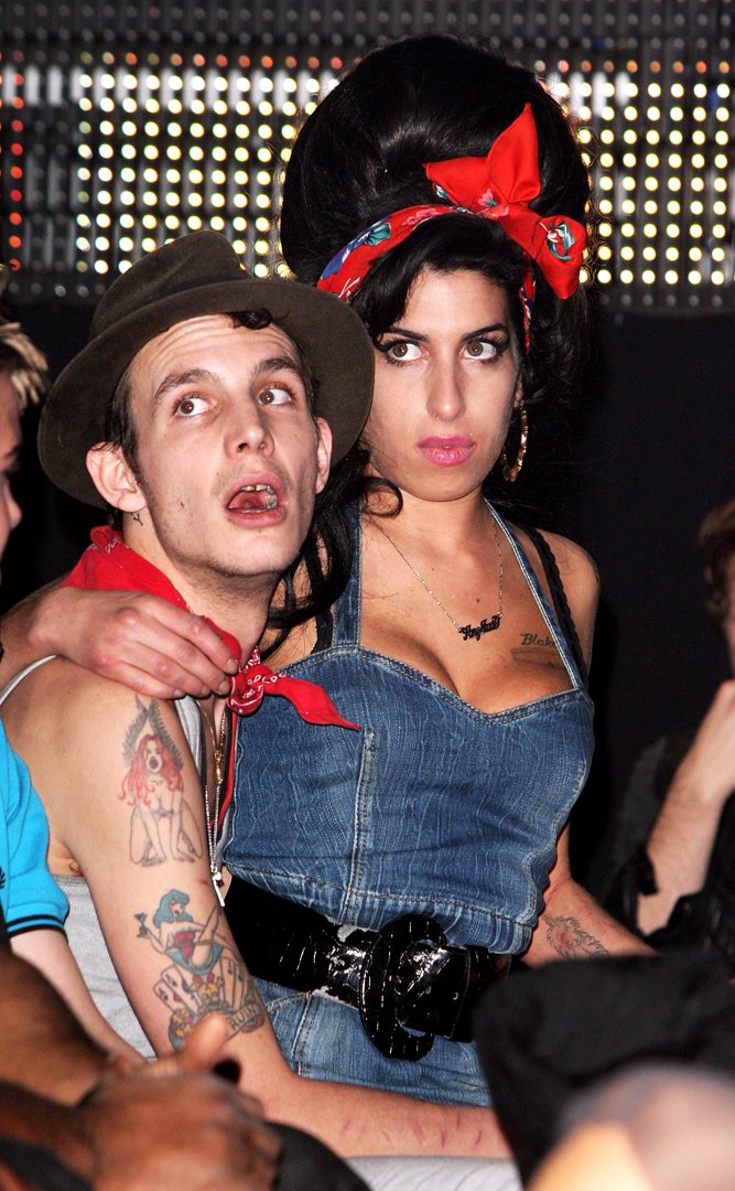 Blake Fielder-Civil and Amy Winehouse are photographed at the MTV Europe Music Awards in Munich, Germany, on November 1, 2007, an event that placed the couple under an intense international spotlight. The image captures them amid the chaos of a major awards ceremony, at a time when Winehouse's meteoric success and deeply scrutinised personal life were becoming increasingly intertwined.