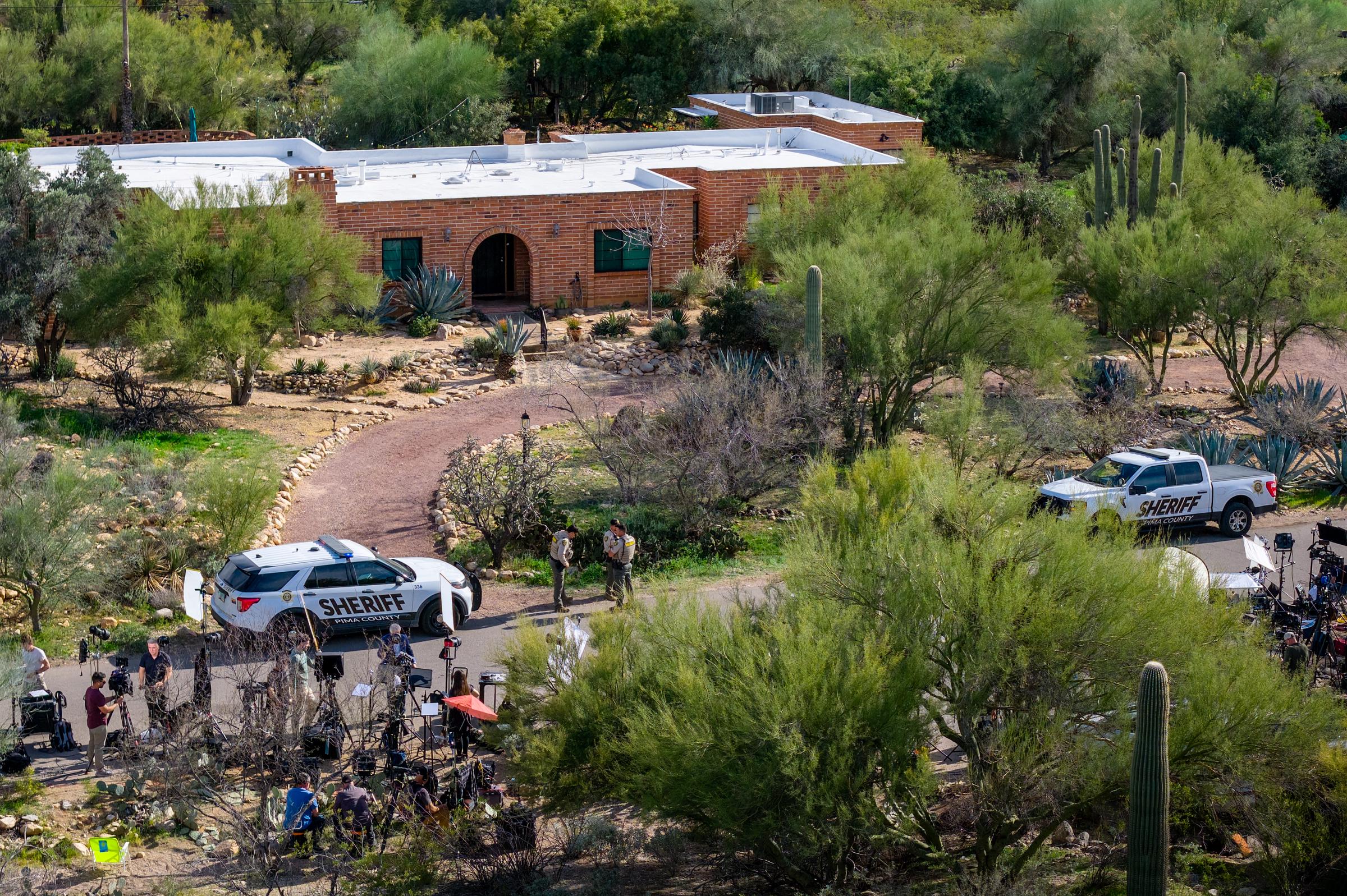An aerial view shows law enforcement and media gathered outside Nancy Guthrie's residence in Tucson, Arizona, on February 10, 2026 | Source: Getty Images