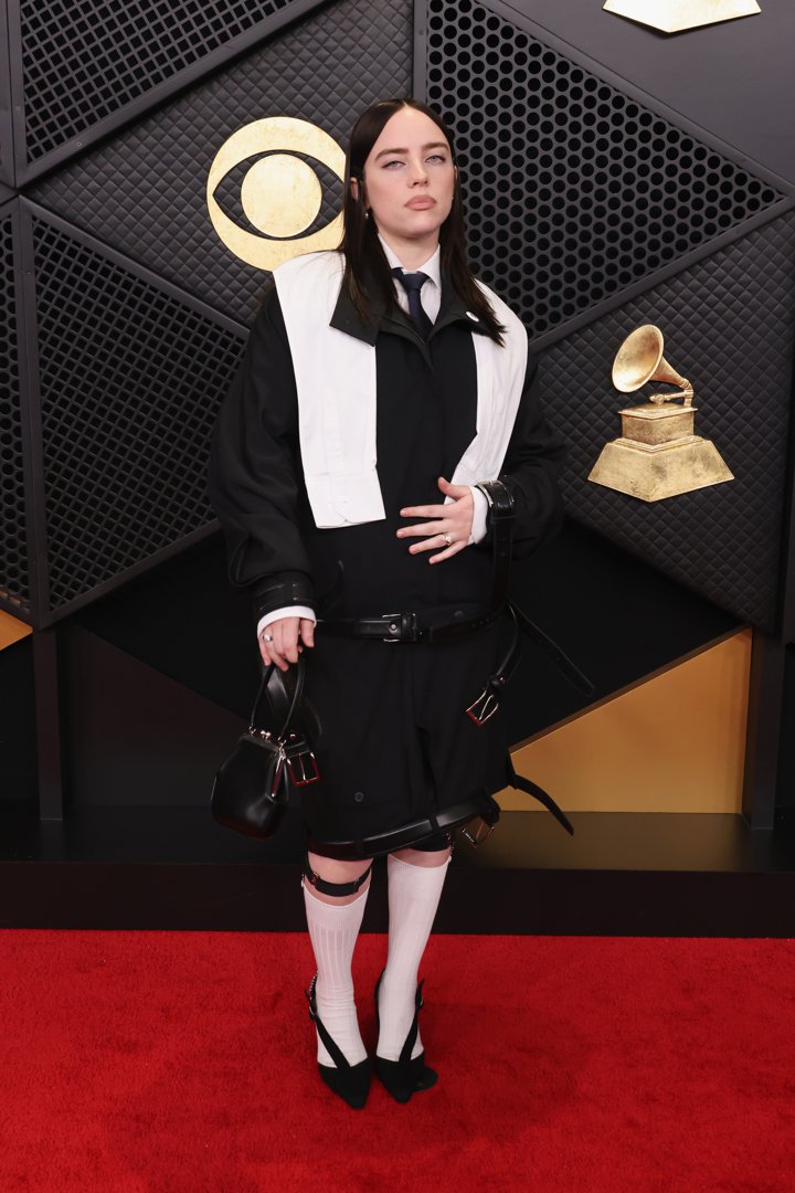 Billie Eilish poses for photographers near the arrivals area | Source: Getty Images