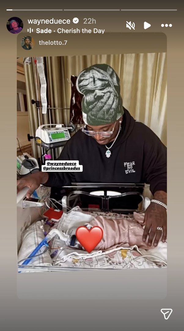 Wayne Deuce stands beside his baby during a hospital stay | Source: Instagram/wayneduece