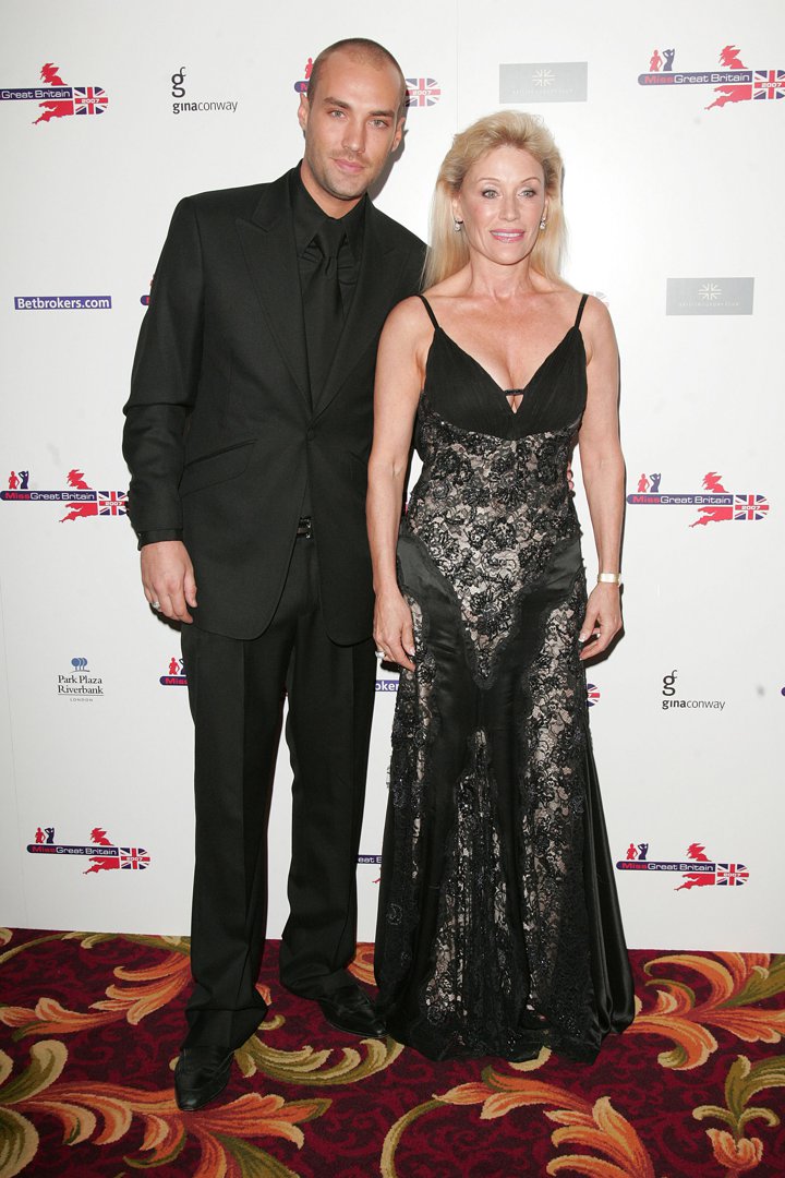 Angie arrives in style alongside Calum at the Miss Great Britain 2007 red carpet at Grosvenor House in London. Dressed in coordinated black, she radiates polished sophistication, proving that her flair for glamour remains undimmed as mother and son pose confidently for photographers.