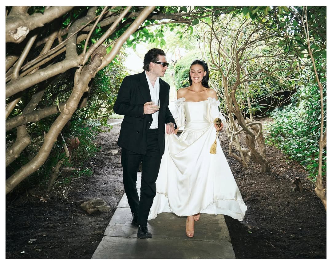 Brooklyn Beckham and Nicola Peltz pose on the day of their vow renewel in images published 11 August 2025. | Source: Instagram/brooklynpeltzbeckham