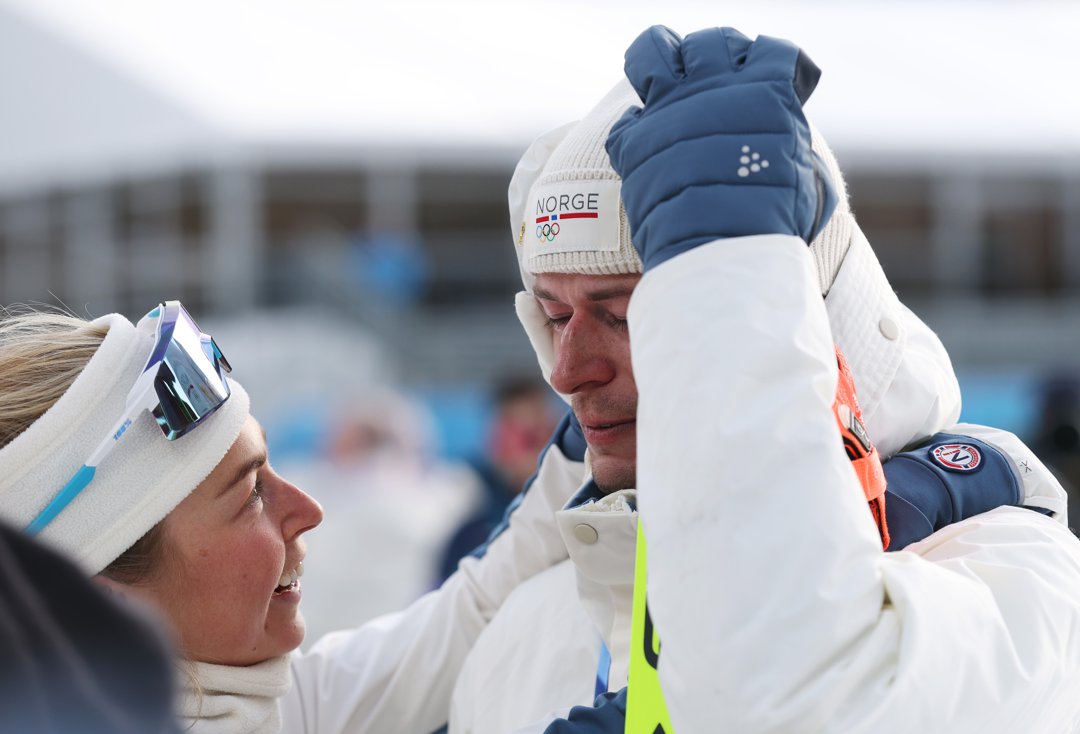 Ingrid Landmark Tandrevold and Sturla Holm L&aelig;greid of Team Norway after the medal ceremony for the Men's 20km Individual on Day 4 of the Milano Cortina 2026 Winter Olympic Games on February 10 in Antholz-Anterselva, Italy. | Source: Getty Images