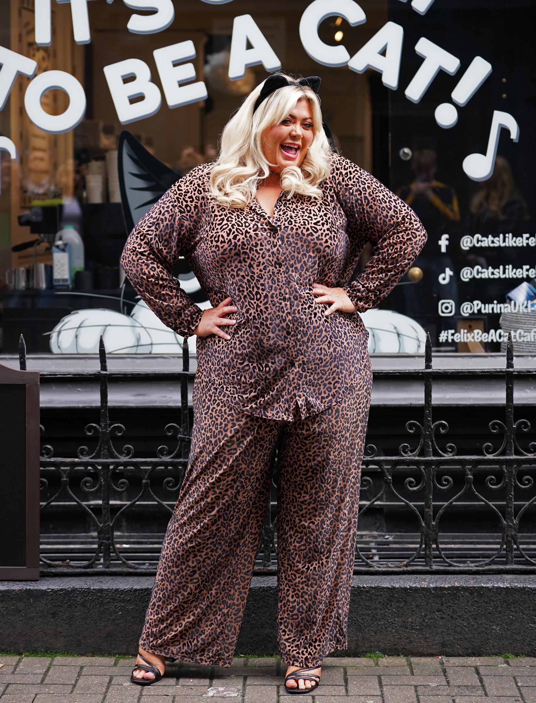 Gemma Collins brought her playful side to the opening of the Be A Cat Café in Soho, central London, on March 30, 2023. Dressed in a leopard print co-ord with black strappy sandals and a headband featuring cat ears, Collins struck a fun pose outside the venue. The look captured her signature flair and sense of humour, as she continued to embrace life — and fashion — with bold confidence and charm.