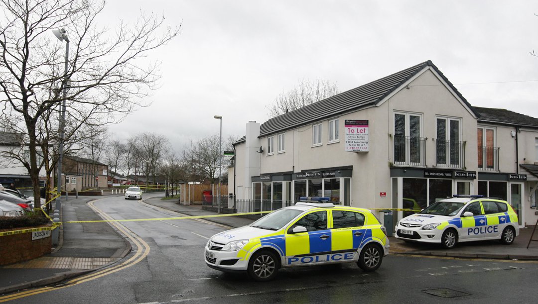 Police officers at a crime scene in Warrington, United Kingdom. | Source: Getty Images