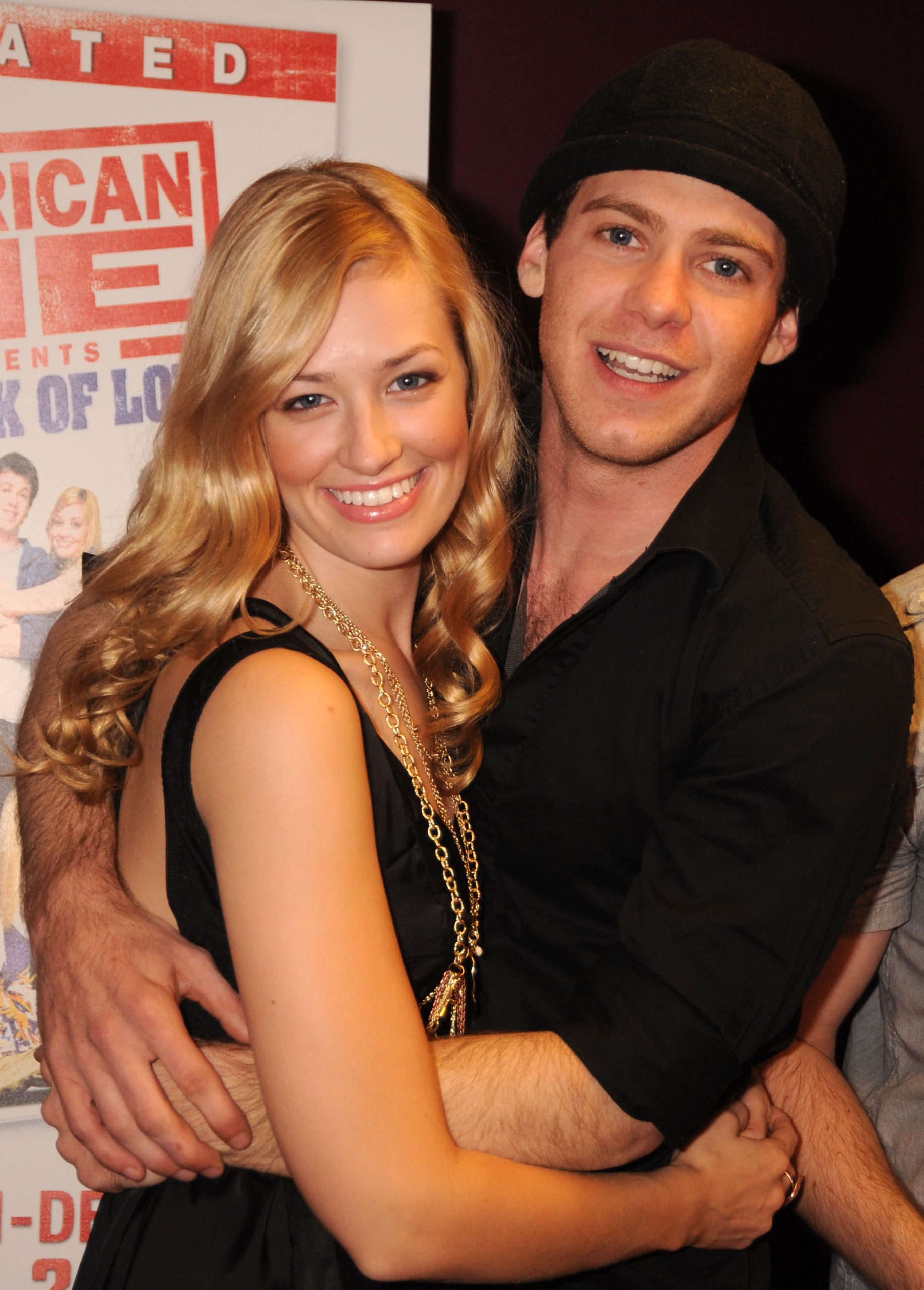 Beth Behrs and Bug Hall share a warm, beaming embrace at the