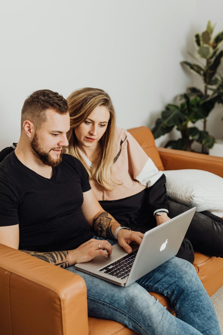 A couple watching something on a laptop | Source: Pexels