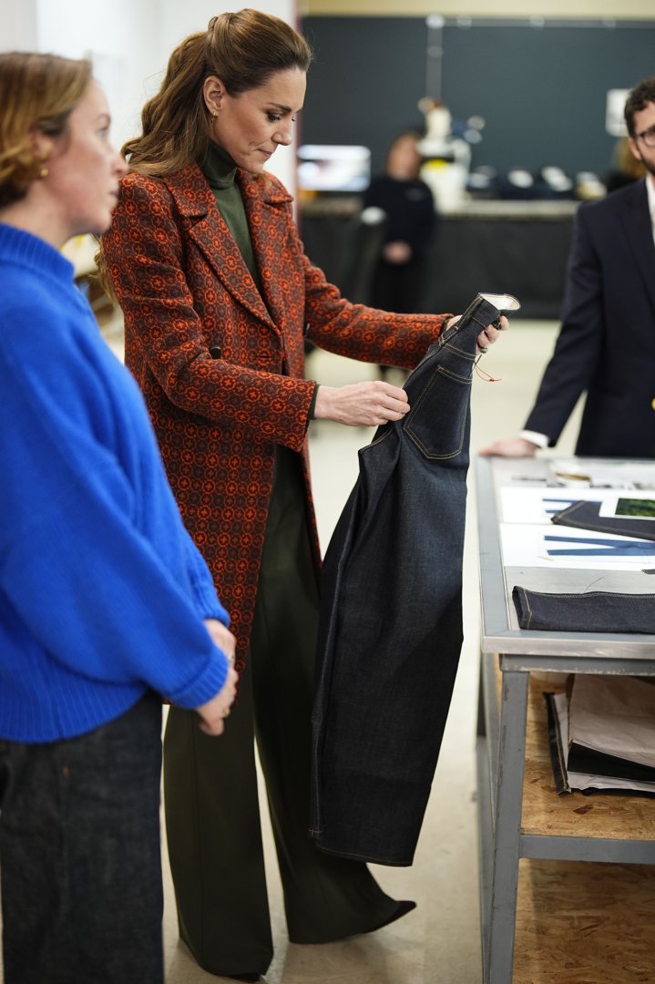 Catherine, Princess of Wales is shown a pair of jeans during a visit to Hiut Denim, a family-owned company designing and manufacturing premium jeans entirely in the UK, on 3 February 2026 in Cardigan, Wales. | Source: Getty Images