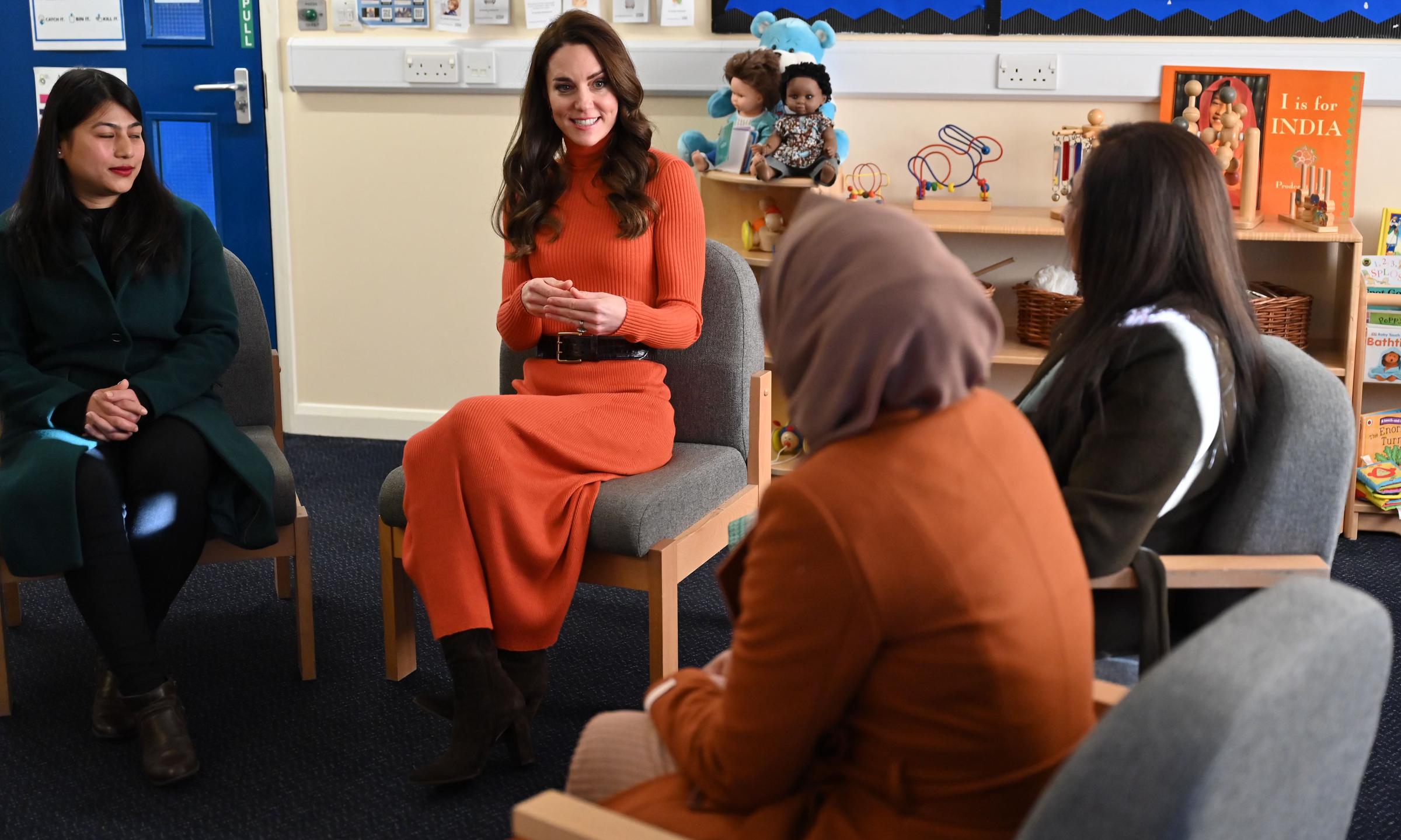 Catherine, Princess of Wales talks with parents during her visit to Foxcubs Nursery on 18 January 2023 in Luton, England. | Source: Getty Images