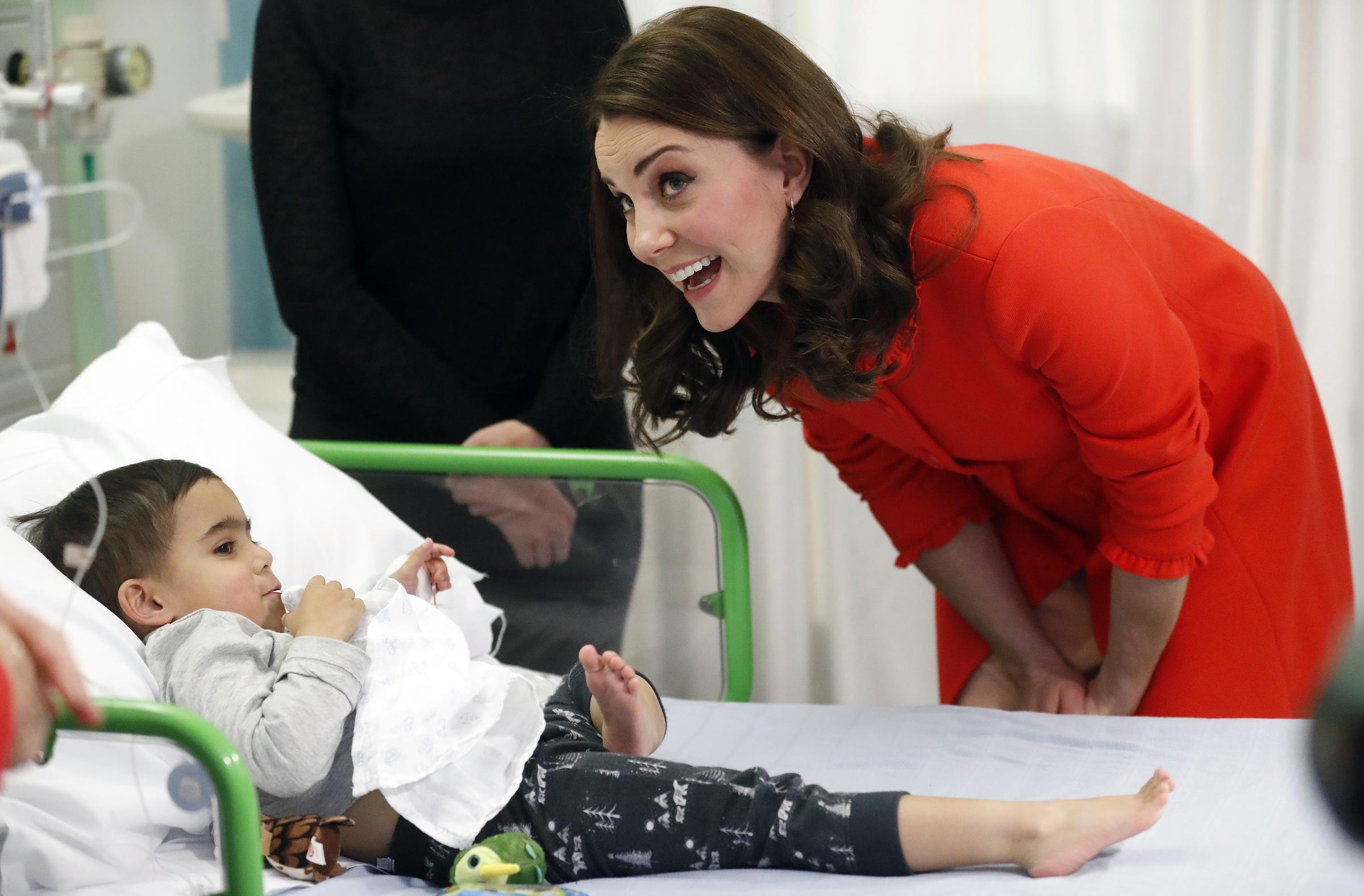 Catherine, Princess of Wales speaks to a patient as she visits Great Ormond Street Hospital to officially open the Mittal Children's Medical Centre, home to the new Premier Inn Clinical Buildingon, on 17 January 2018 in London, England. | Source: Getty Images