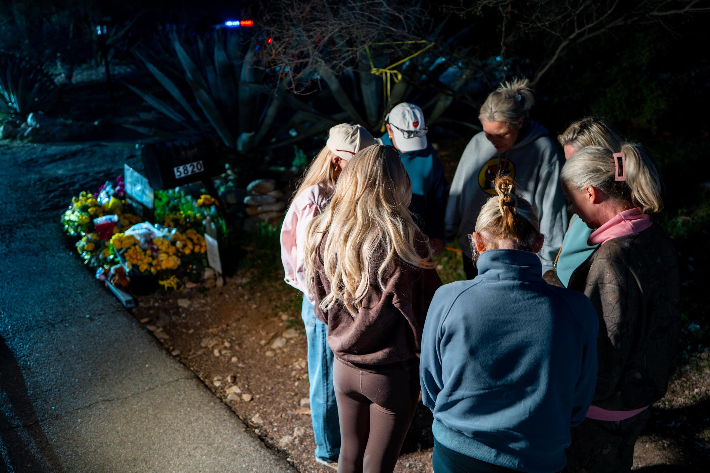 Residents gather at a tribute site outside Nancy Guthrie's Tucson home during the ongoing search on February 12, 2026 | Source: Getty Images