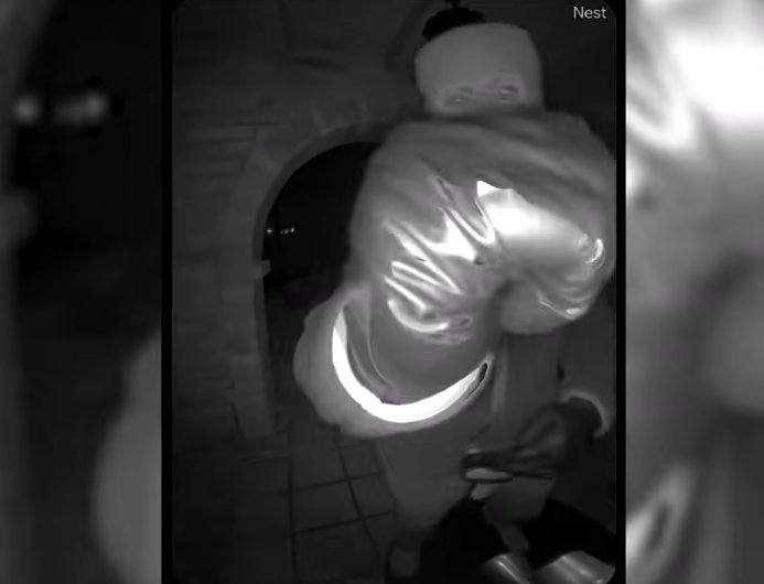 A masked individual on Nancy Guthrie's front porch, from a video dated February 10, 2026 | Source: YouTube/USA Today