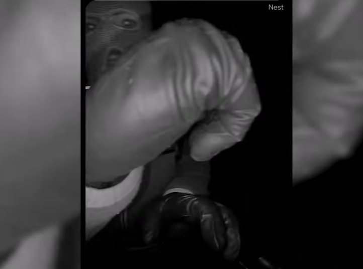 A masked individual on Nancy Guthrie's front porch, from a video dated February 10, 2026 | Source: YouTube/USA Today