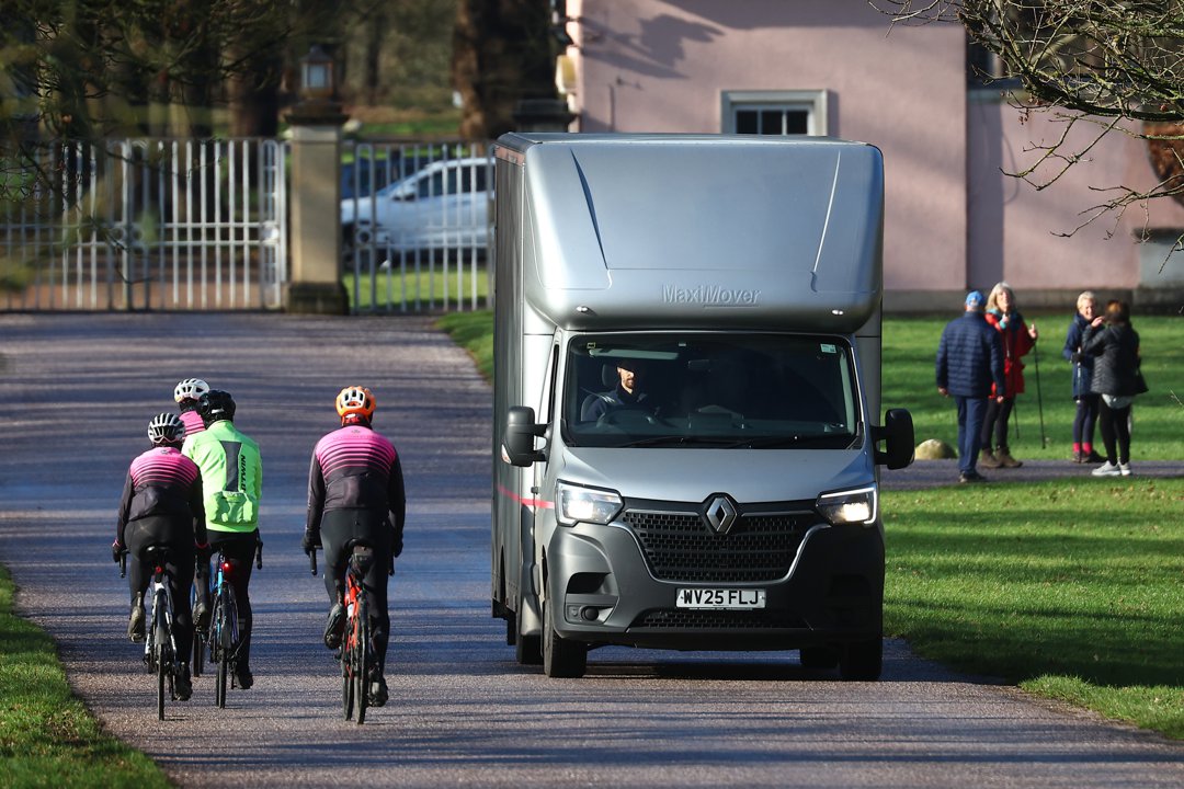 Cyclists and walkers continue their routines in Windsor Great Park as a removals van travels along the private drive leading from Royal Lodge, highlighting the subdued and practical nature of Andrew Mountbatten-Windsor's removal. The scene captured the stark shift from royal privilege to logistical necessity following his move to Norfolk earlier that week.