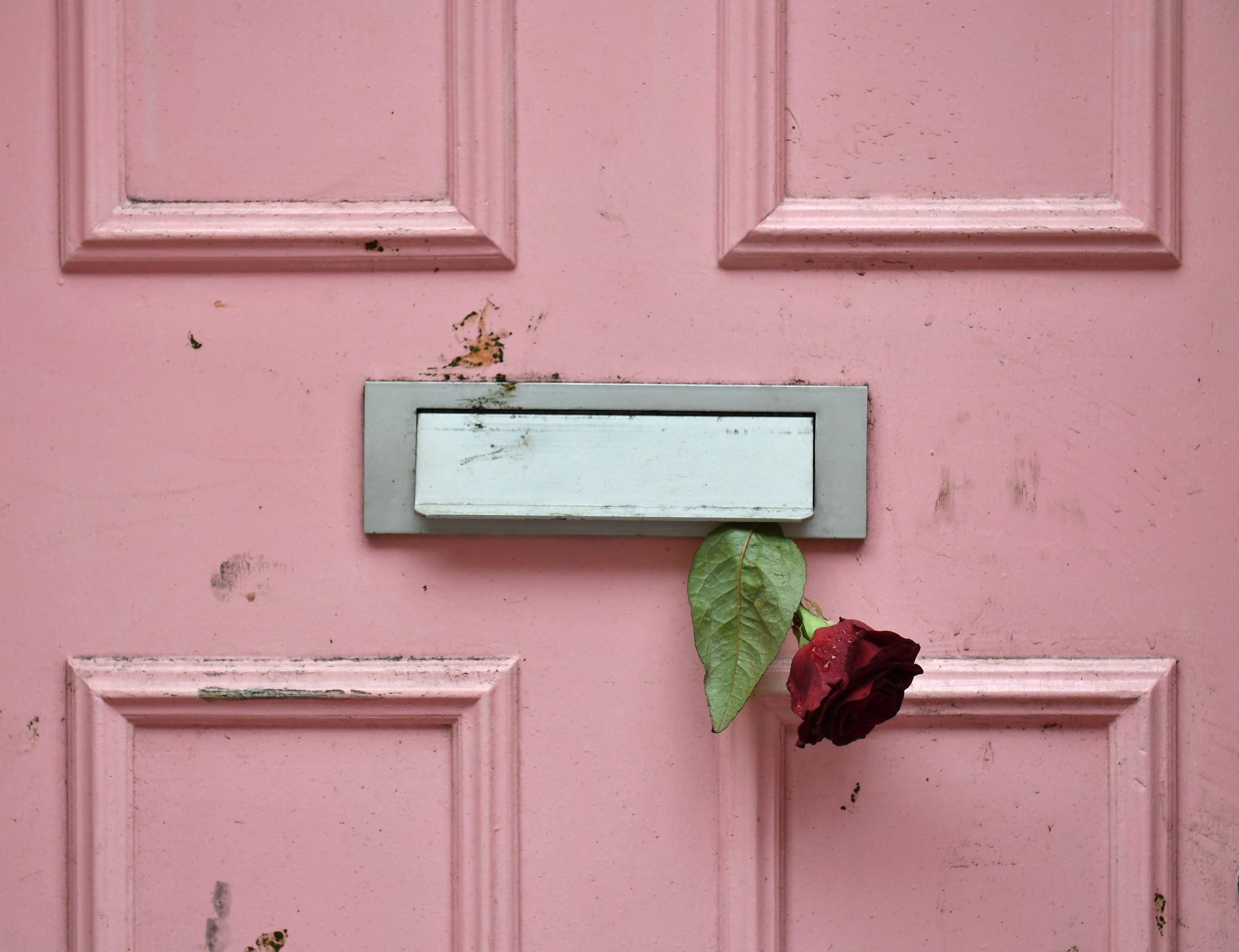 A floral tribute placed outside Caroline Flack's former home in London, England. | Source: Getty Images