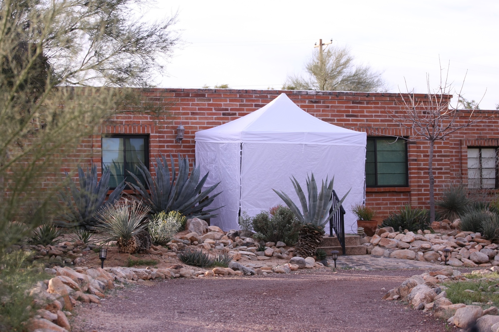 A view of the security inspection tent outside of Nancy Guthrie's residence on February 12, 2026 | Source: Getty Images