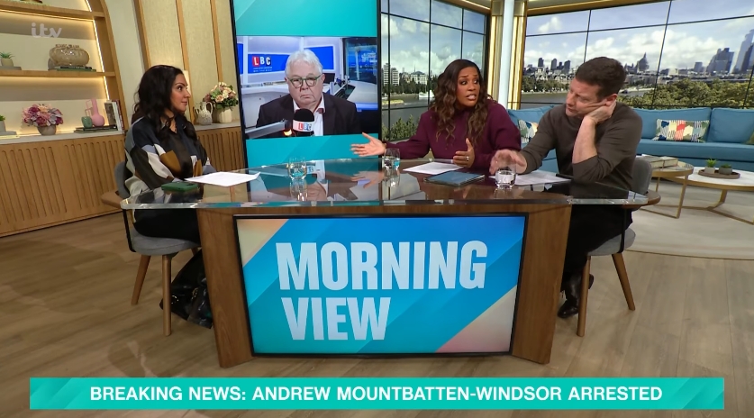 The wider studio shot reveals the full panel engaged in animated conversation, with Hammond gesturing across the desk while her co-host listens closely. The composition highlights the immediacy of the exchange, as the arrest headline remains fixed on screen and the discussion gathers pace. | Source: YouTube/This Morning