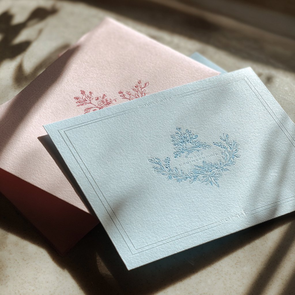 Pastel baby shower invitations on a table | Source: Midjourney