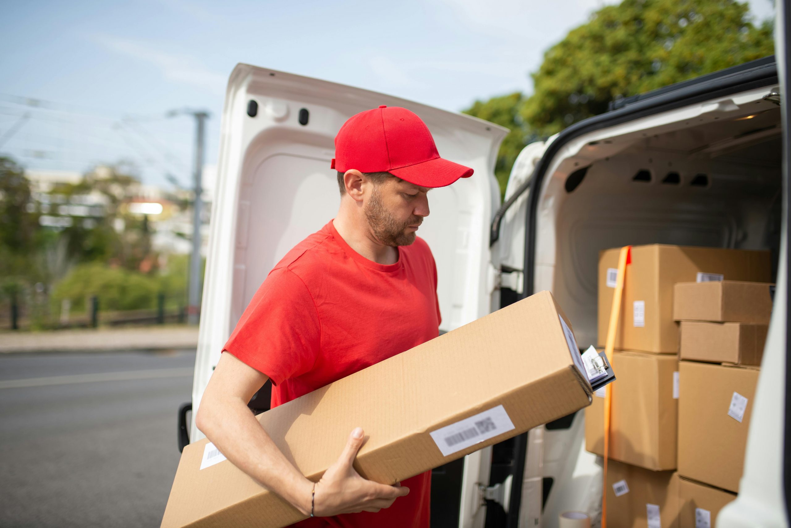 A man standing next to a delivery van | Source: Pexels
