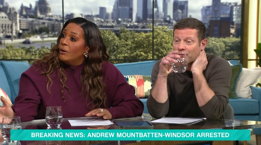 Hammond is pictured speaking emphatically while her co-host raises a glass of water, the lower-third graphic still declaring the arrest. The candid frame captures the unscripted nature of live television, as the presenters navigate a fast-moving and highly sensitive news development. | Source: YouTube/This Morning