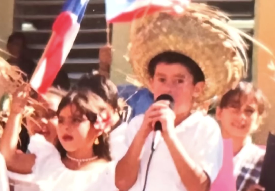 Bad Bunny wears a sombrero hat as he sings, from a post dated August 31, 2025. | Source: YouTube/TODAY