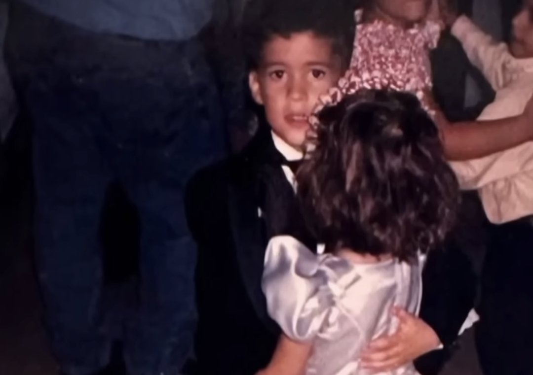 Bad Bunny in a suit dances with a girl, from a post dated August 31, 2025. | Source: YouTube/TODAY