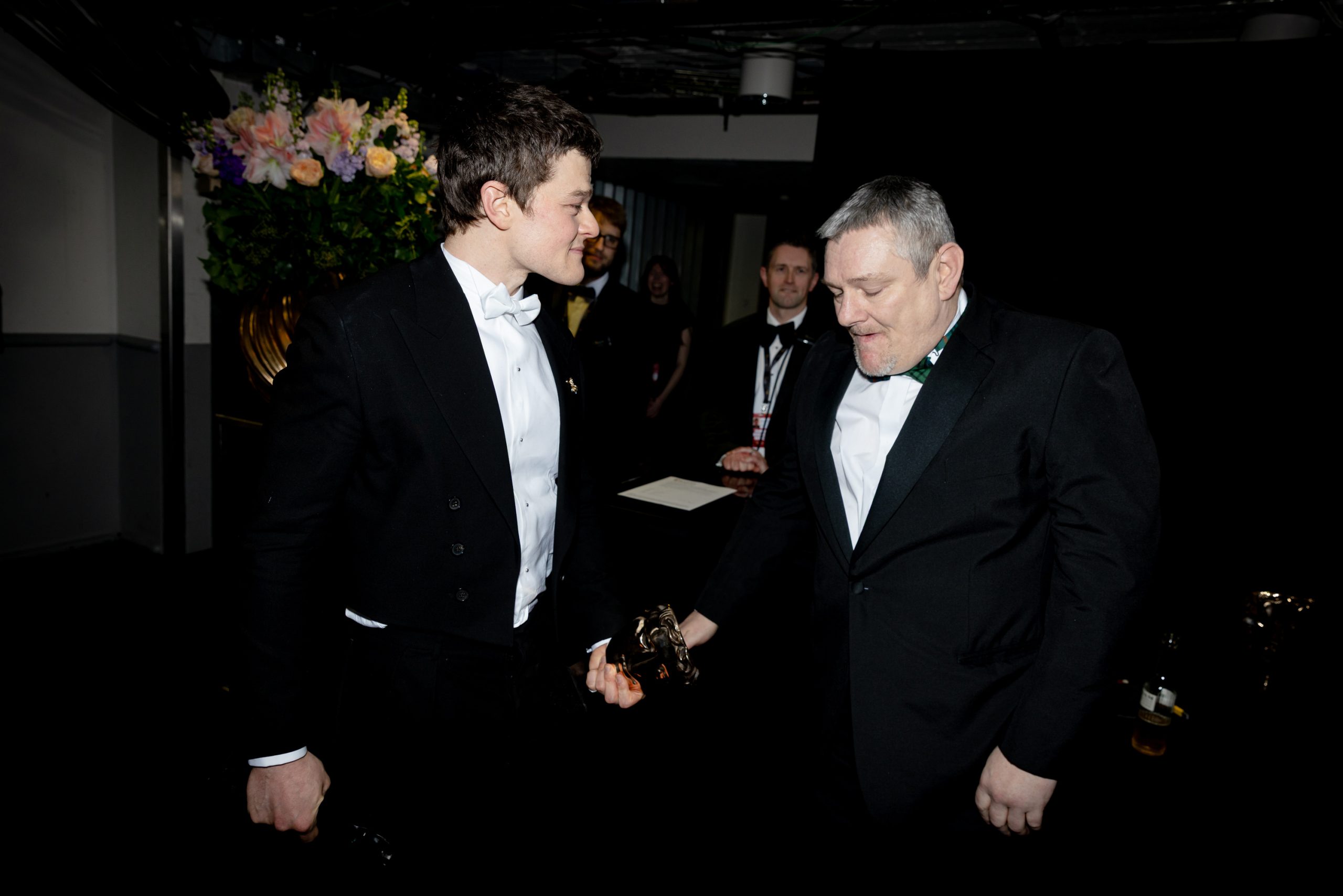 Robert Aramayo and John Davidson backstage during the EE BAFTA Awards on February 22, 2026, in London, England. | Source: Getty Images
