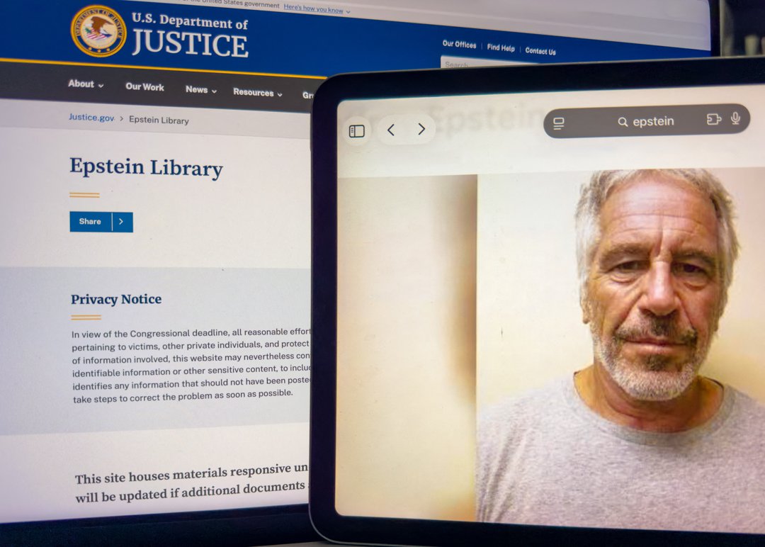 A tablet screen displays a portrait of Jeffrey Epstein beside the official U.S. Department of Justice