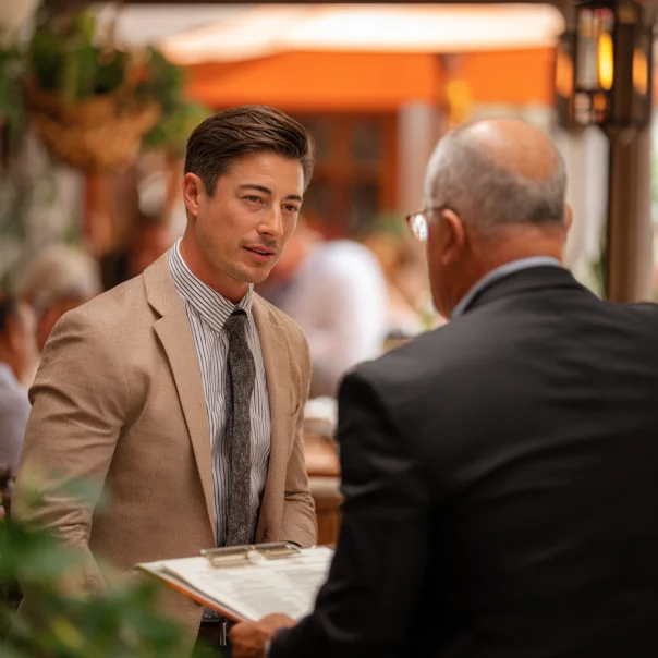 A man talking to a restaurant manager | Source: Midjourney