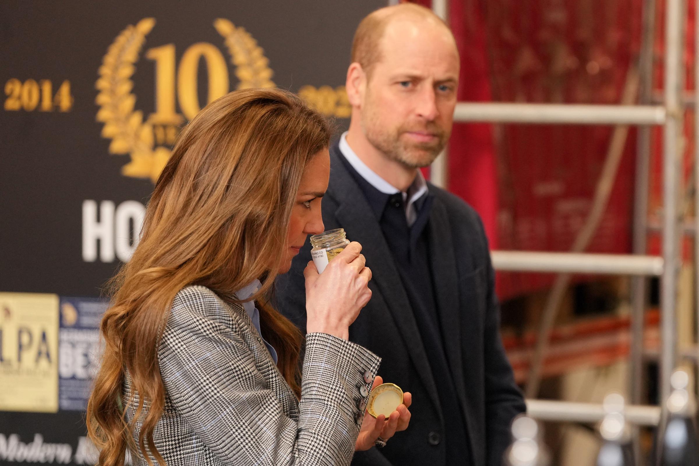 With Prince William looking on behind her, the Princess of Wales leans in to smell what appears to be a jar of brewing ingredients during the couple's visit to the Southwark Brewing Company on 12 March 2026. The moment captures a lighter side of what turned out to be a rather eventful afternoon &mdash; one that also produced a memorable verdict from the Prince of Wales.