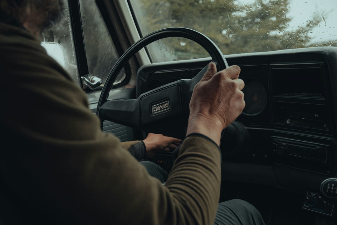 A man's hand starting the ignition of a vehicle | Source: Unsplash