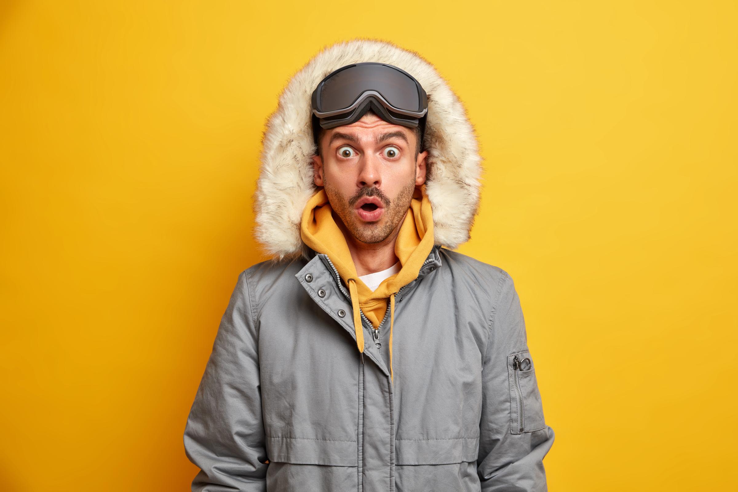A shocked man in winter clothing | Source: Freepik
