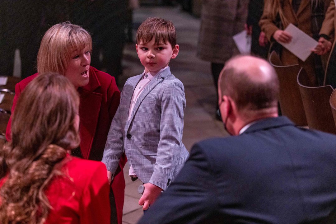 A smartly dressed Tony meets Prince William and Princess Catherine during the Together At Christmas community carol service at Westminster Abbey, London, on 8 December 2021. Tony, accompanied by his mother Paula in a red coat, had by then raised more than &pound;1.5 million for Evelina London Children's Hospital.