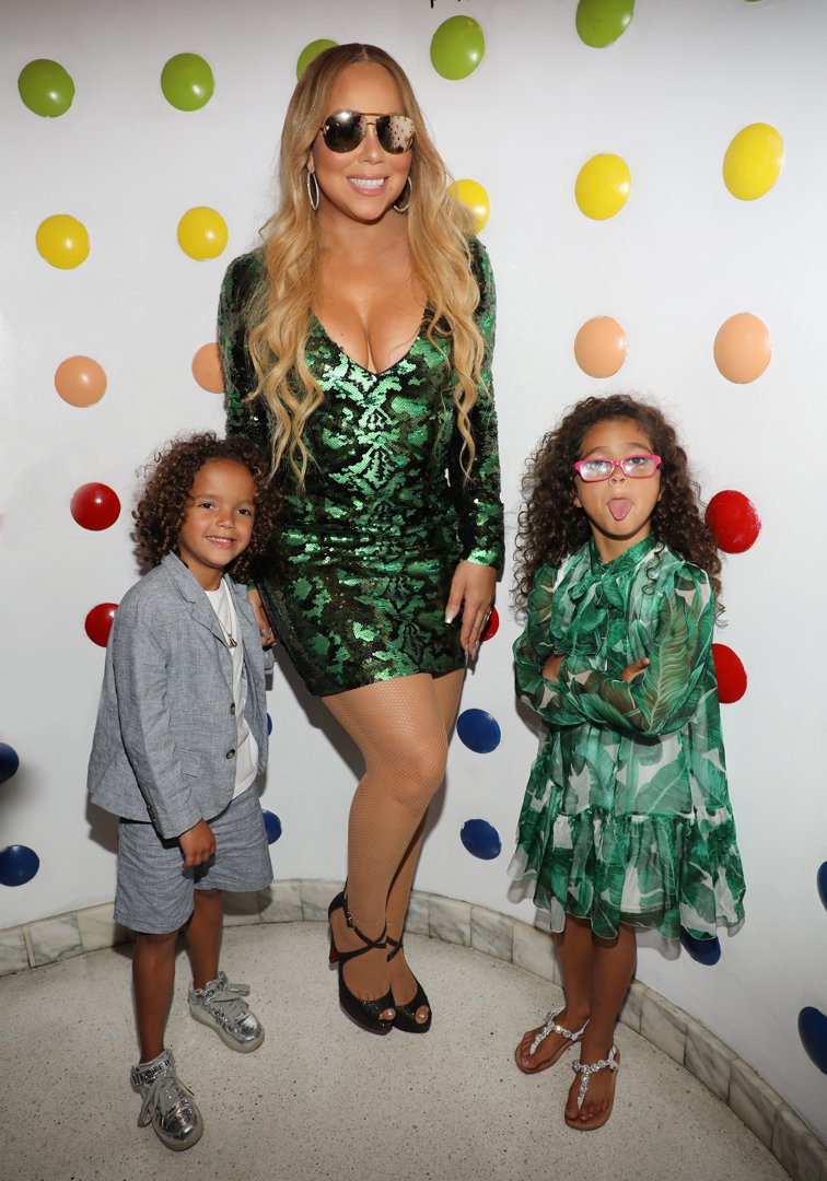 Mariah Carey with Moroccan Scott Cannon and Monroe Cannon, attend the singer's concert afterparty at Sugar Factory American Brasserie on August 10, 2017 | Source: Getty Images