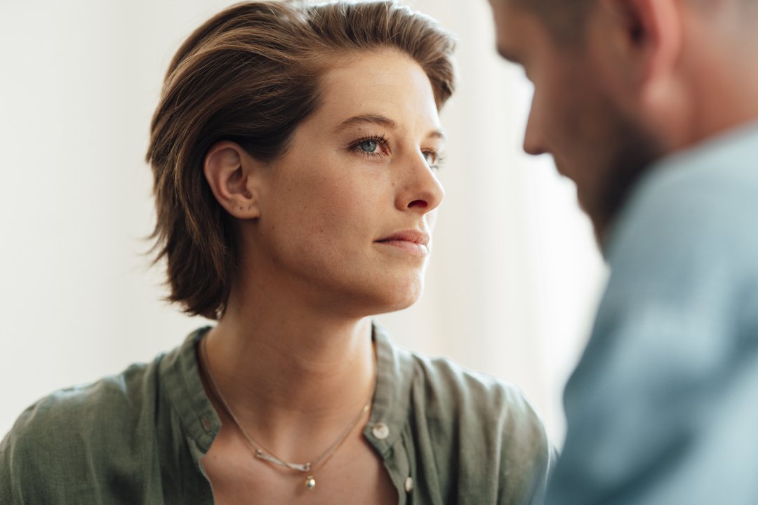Suspicious woman looking at man | Source: Getty Images