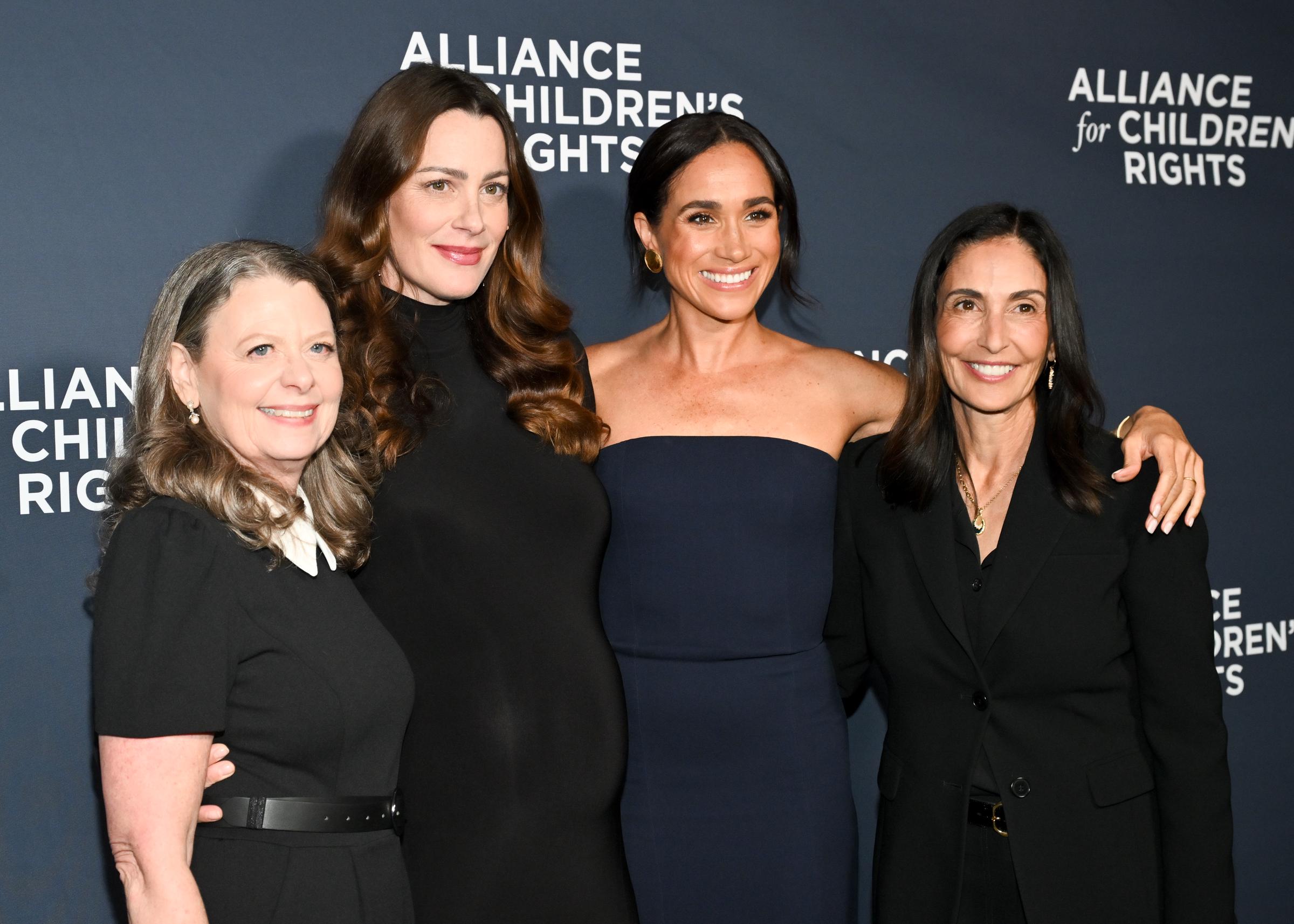 Meghan, Duchess of Sussex poses with friends | Source: Getty Images