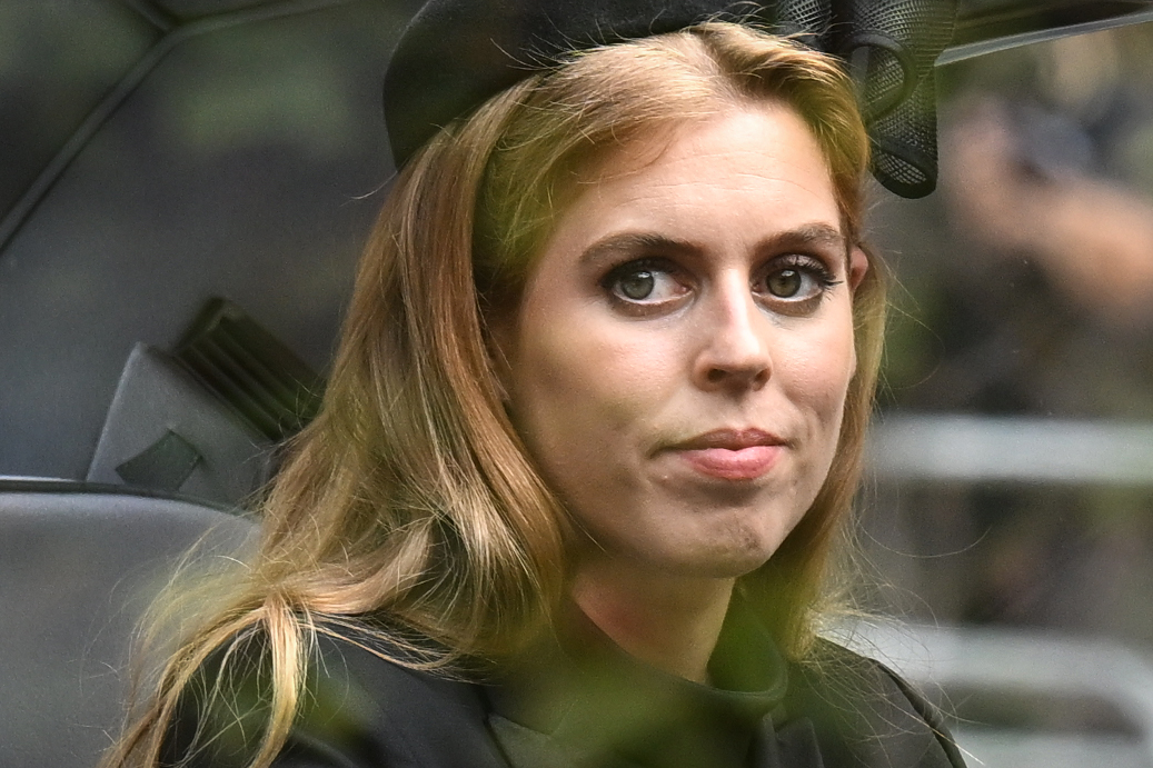 Princess Beatrice of York follows the coffin of Queen Elizabeth II, draped in the Royal Standard, as it travels on the State Gun Carriage of the Royal Navy from Westminster Abbey to Wellington Arch, on 19 September 2022 in London, England. | Source: Getty Images