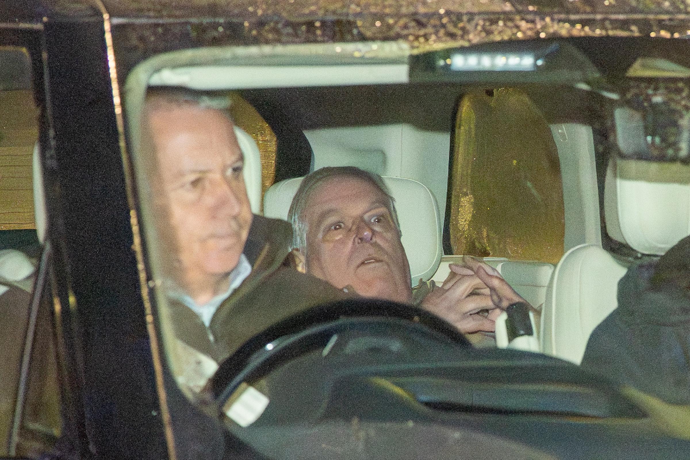 A close-up of Andrew Mountbatten-Windsor being driven away from a police station following his arrest on suspicion of misconduct in a public office.