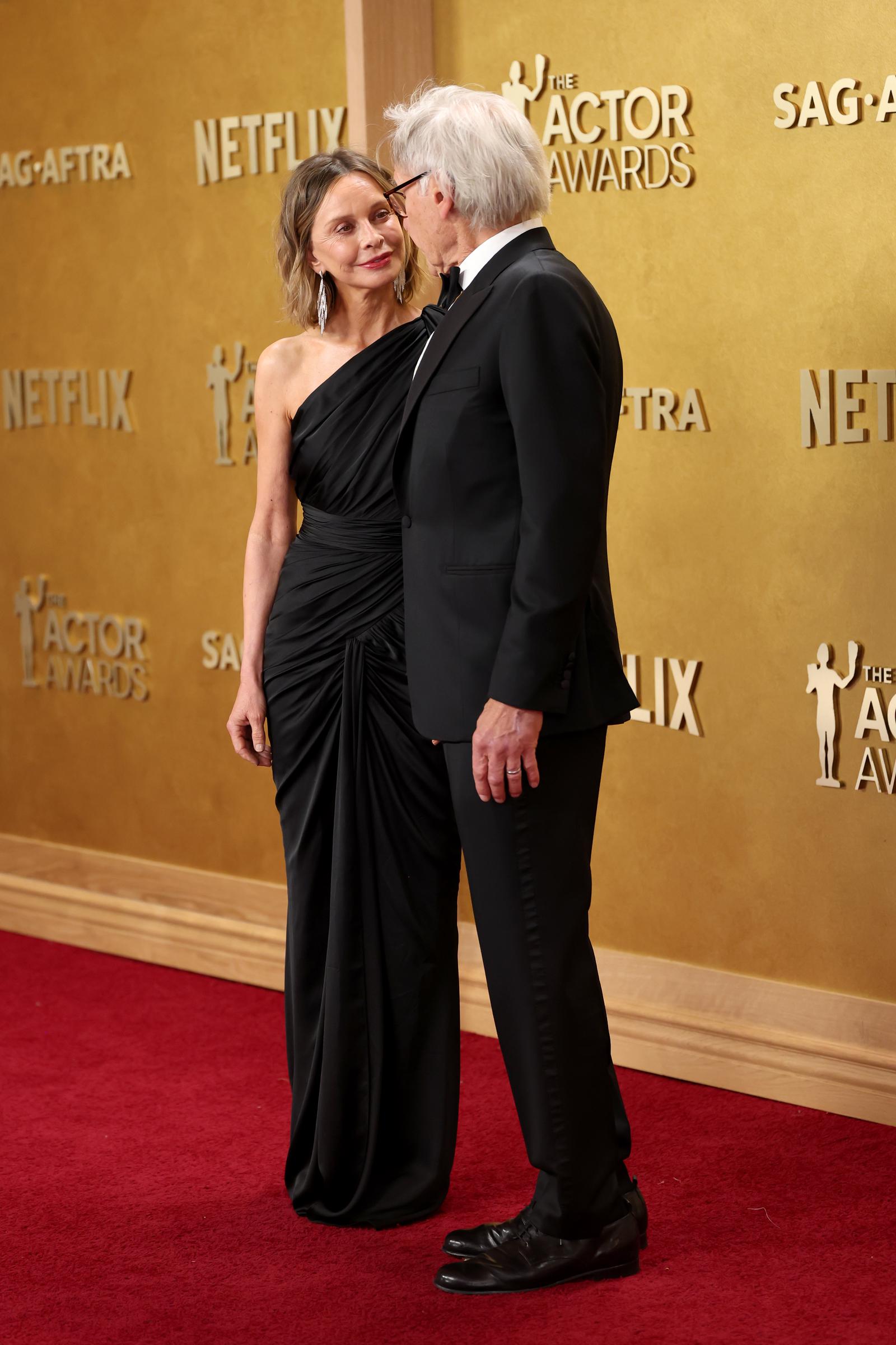 At the 32nd Annual Actor Awards at Shrine Auditorium and Expo Hall, Calista Flockhart and Harrison Ford share a sweet look. | Source: Getty Images