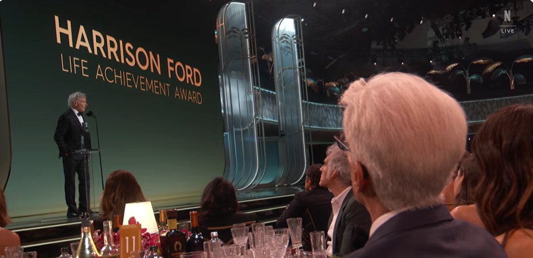 Actors in the audience listen to Harrison Ford's emotional and heartfelt speech. | Source: YouTube/Netflix