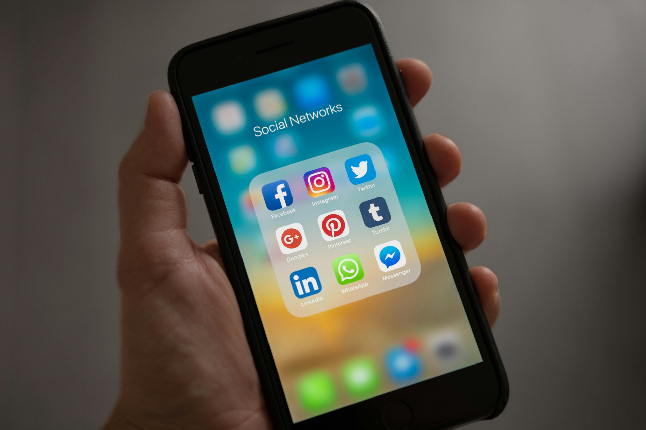 A person holding a cellphone open to social media apps | Source: Pexels
