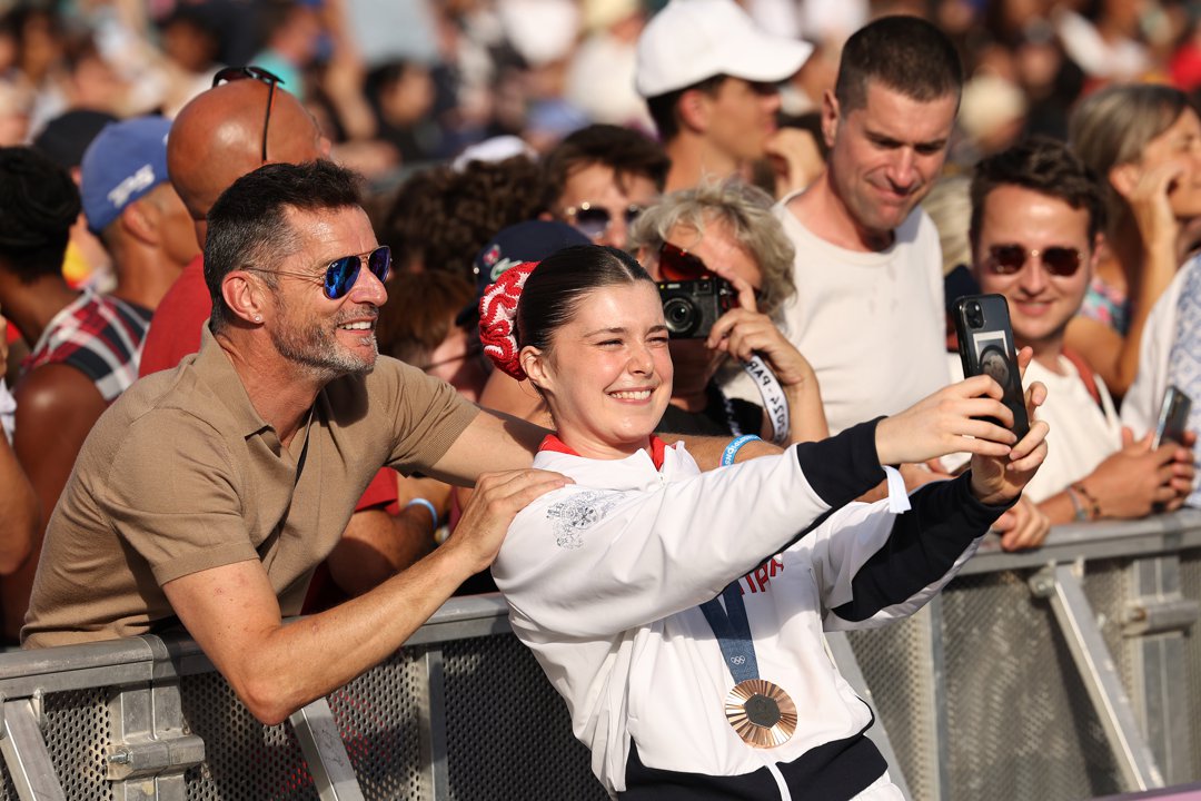 Andrea Spendolini-Sirieix of Team Great Britain takes a selfie with her father Fred Sirieix on day twelve of the Olympic Games Paris 2024 at Champions Park on 7 August in France. | Source: Getty Images