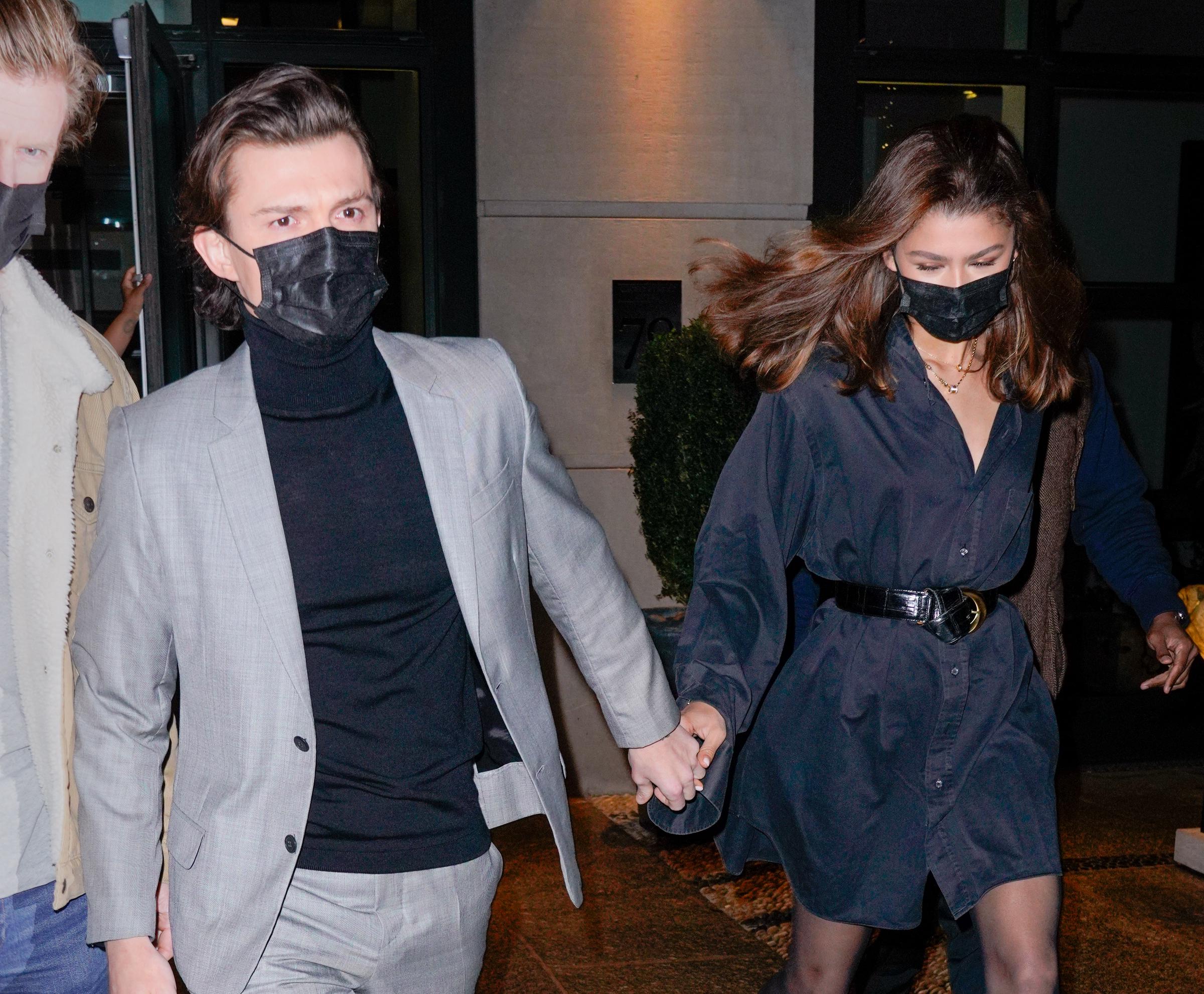 Spotted in a rare off-duty moment, Tom and Zendaya were photographed hand in hand leaving their hotel in New York City on 16 February 2022. Dressed in coordinating dark outfits and wearing masks, the couple kept it low-key — but there was no hiding the quiet strength of their connection, even as they navigated the frenzy of fame.