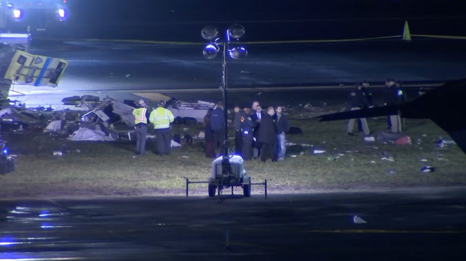 Emergency personnel around the tarmac after an An Air Canada Express plane colliding with a fire truck at LaGuardia Airport on March 23, 2026, in New York City | Source: YouTube/KHOU 11