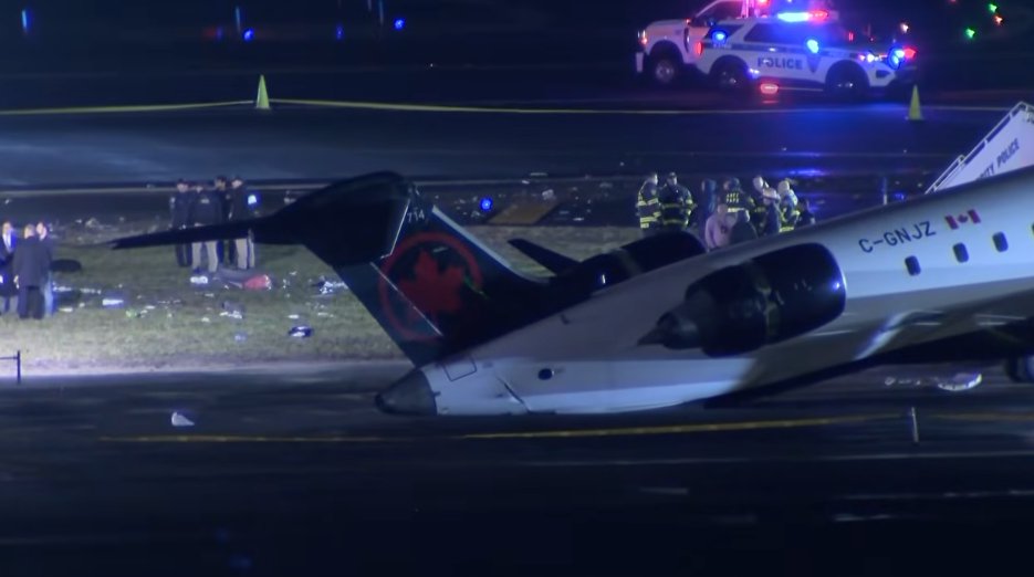 Emergency personnel around the tarmac after an An Air Canada Express plane colliding with a fire truck at LaGuardia Airport on March 23, 2026, in New York City. | Source: YouTube/KHOU 11